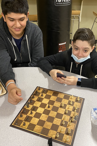 Two students playing chess